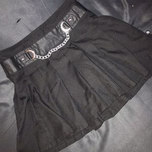 Short black skirt with chain around waste.